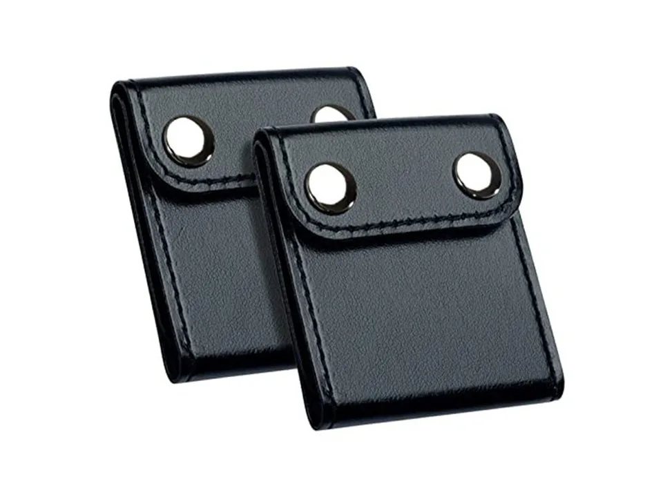 Two black car seat belt adjuster clips.