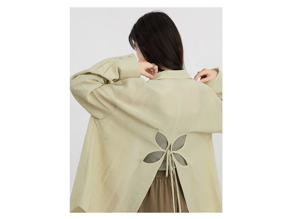 Close-up view of the shirt's back showing the flower-shaped cutout and tie detail.