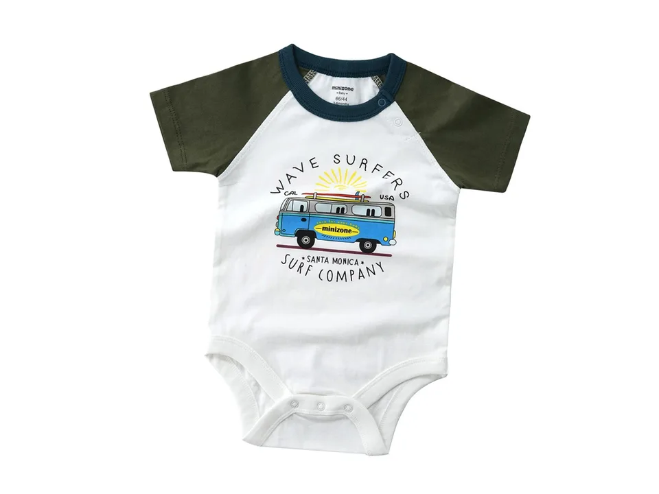 A white baby romper with a surf van graphic and dark green sleeves.