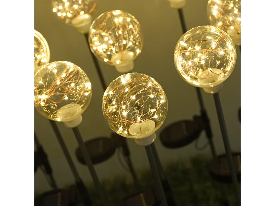 Close-up of the glowing solar ball light with internal fairy lights.