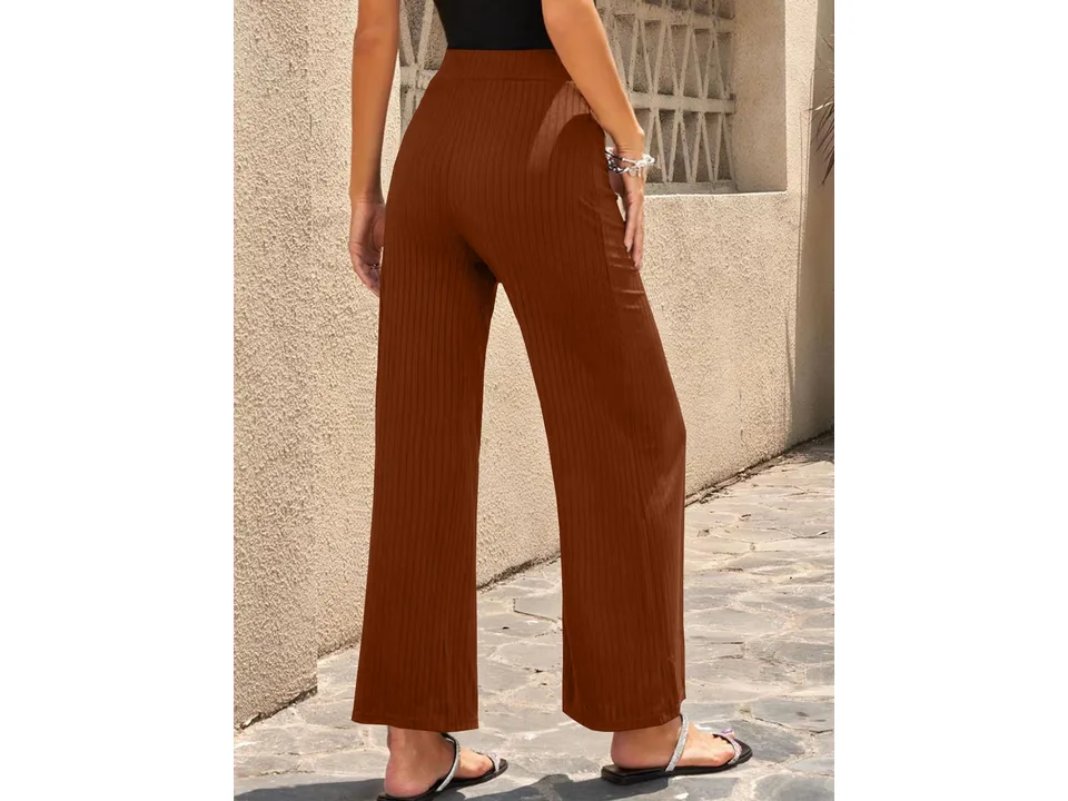 Back view of brown wide-leg ribbed pants on a model.