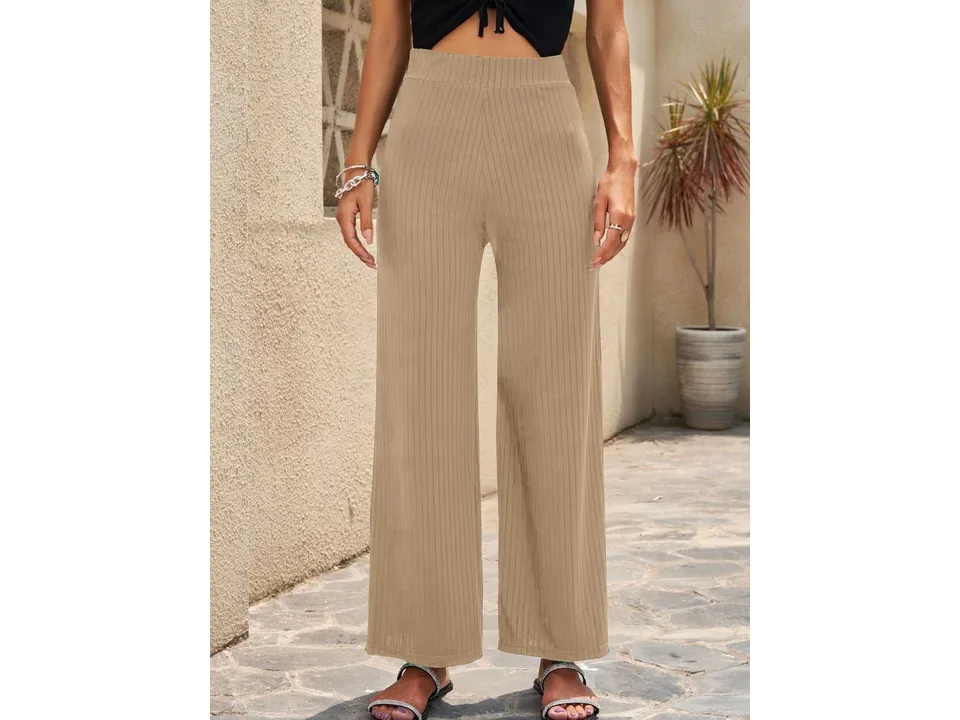 Front view of beige wide-leg ribbed pants on a model.
