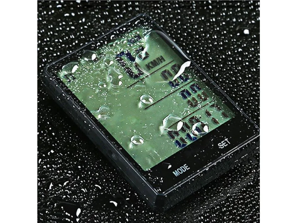 Bicycle computer covered in water droplets, demonstrating water resistance.