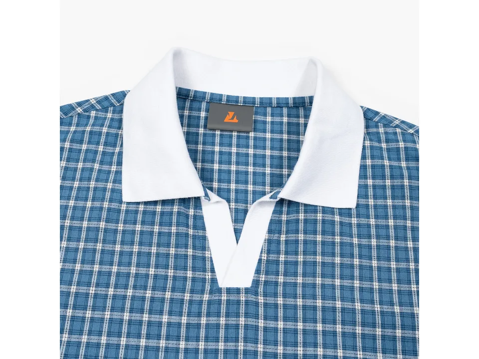 Close-up of the white collar and blue plaid fabric of the polo shirt.