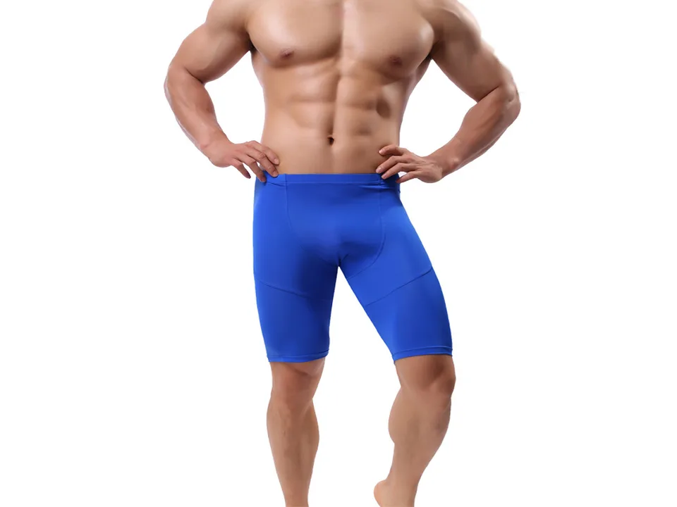 A man wearing blue athletic compression shorts.