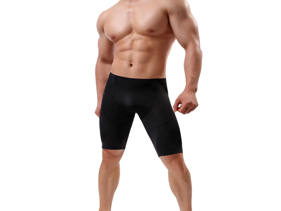 A man wearing black athletic compression shorts.