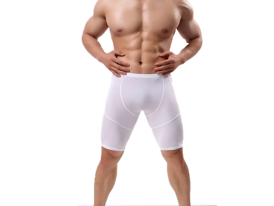 A man wearing white athletic compression shorts.
