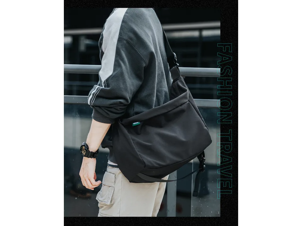 A person wearing the black messenger bag over their shoulder.