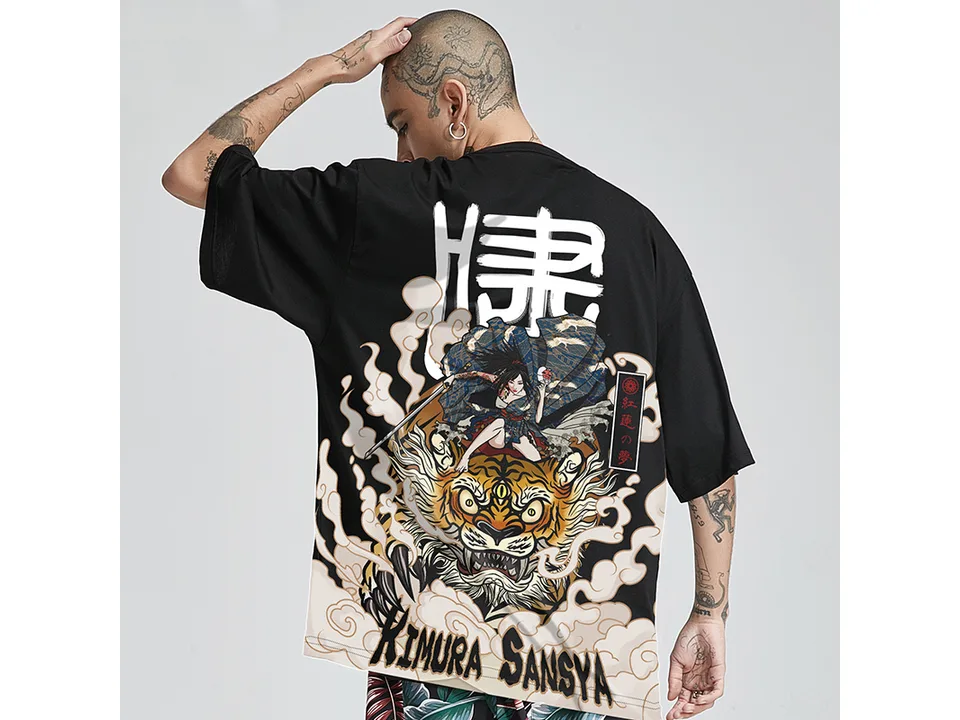 A person wearing a black oversized t-shirt with a large Japanese-style tiger and samurai graphic on the back.