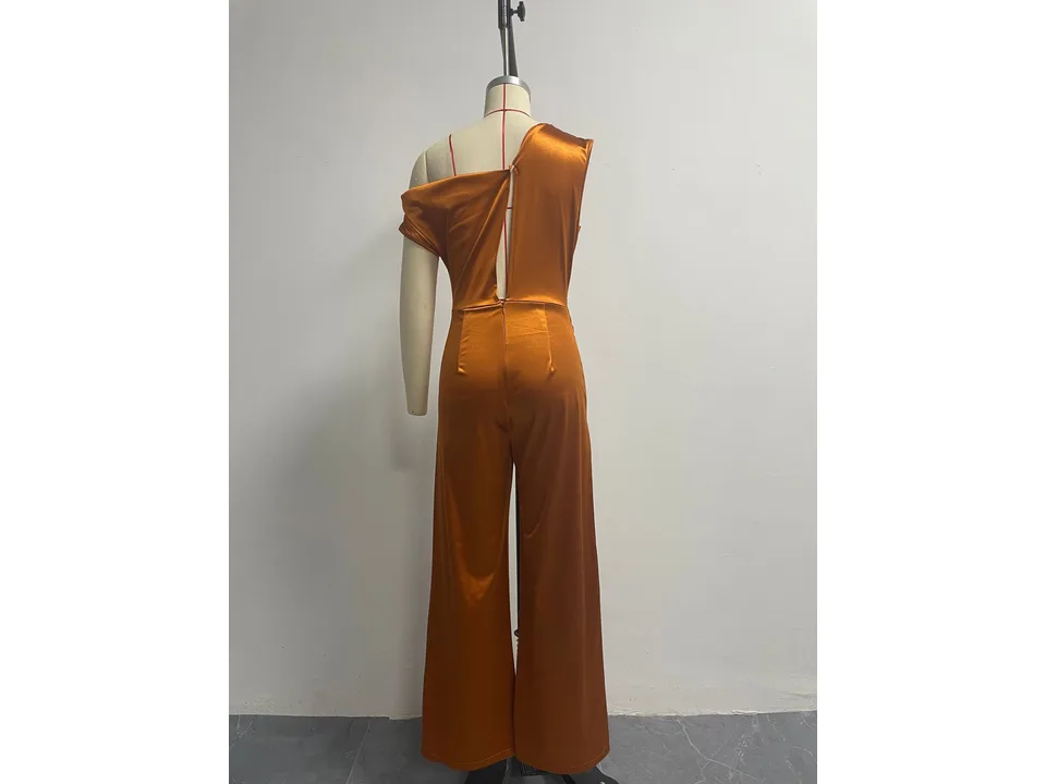 Back view of the rust-colored one-shoulder jumpsuit on a mannequin.