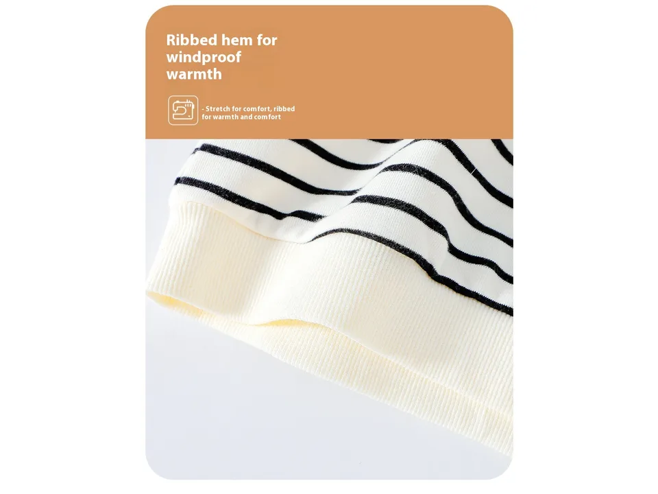 Close-up of the ribbed hem on the striped baby sweatshirt.