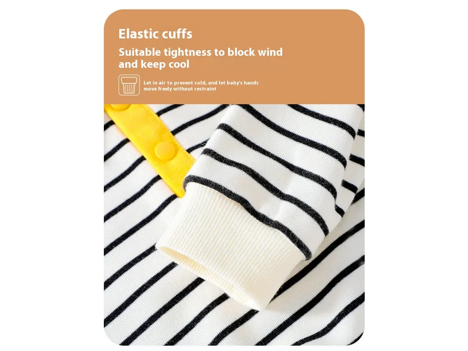 Close-up of the elasticated cuff on the sleeve of the striped baby shirt.