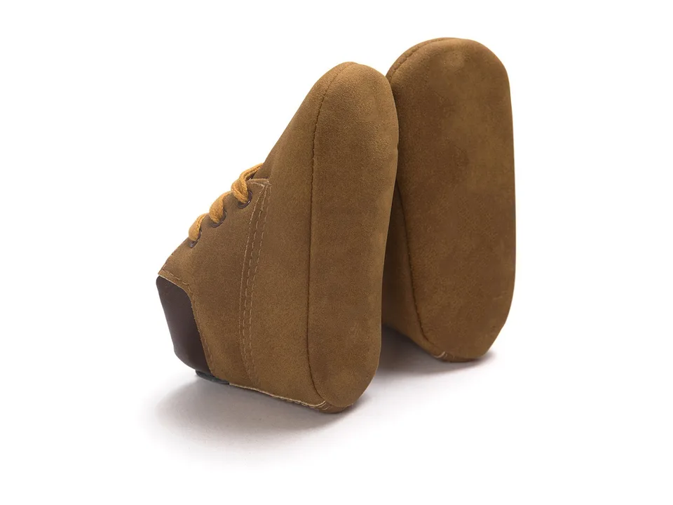 Bottom view of the baby shoes showing the soft sole.