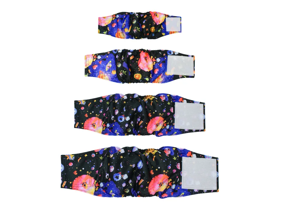 Four dog belly band diapers of different sizes laid out in a row, featuring a space-themed pattern.