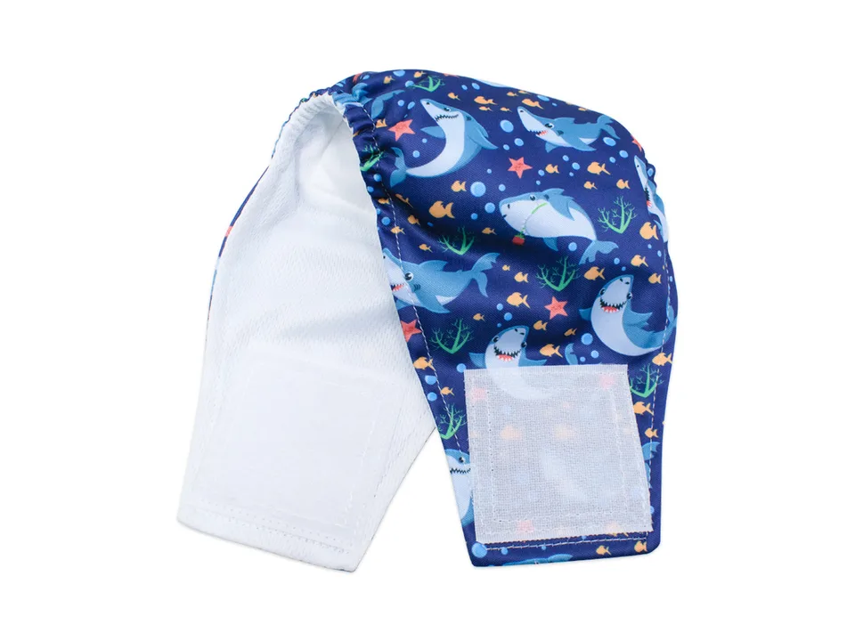 A shark-patterned dog belly band diaper shown flat, displaying the white interior lining and velcro fasteners.