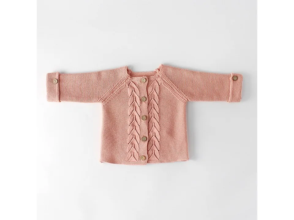 Pink knitted baby cardigan with button closure.
