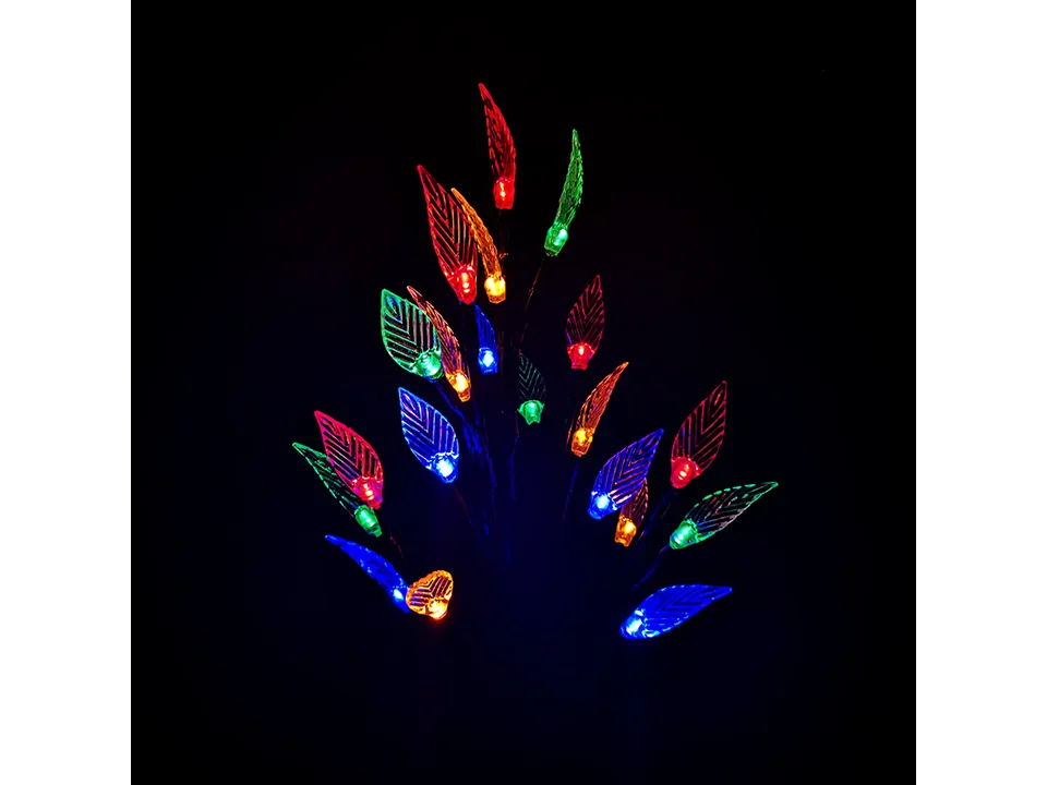 Solar LED leaf branch light glowing with multi-colored lights in the dark.