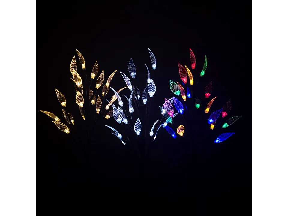 Three solar LED leaf branch lights side-by-side, glowing in warm, white, and multi-colored light.