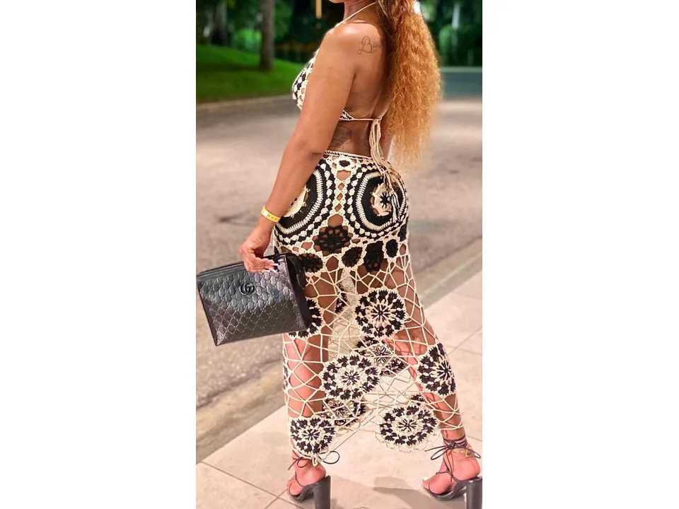 Back view of a woman wearing a black and white crochet bikini set.