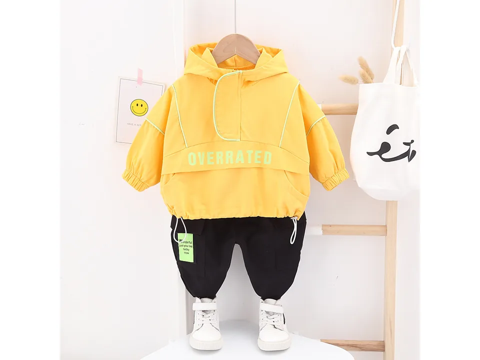 Yellow hooded jacket and black pants set for children.