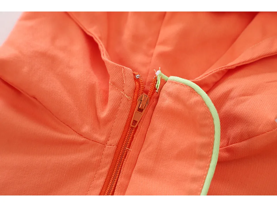 Close-up of the orange jacket hood and zipper.