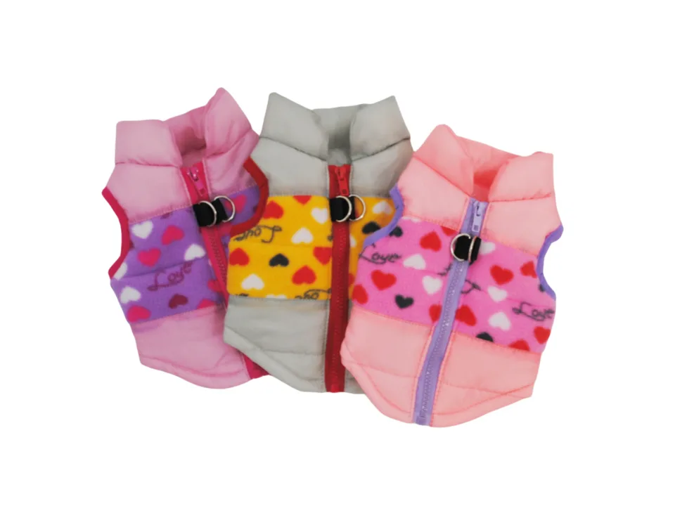 Three dog jackets in pink, grey, and light pink with heart patterns.