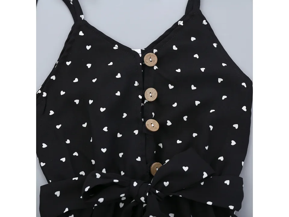 Close-up of the bodice showing the button-down detail and heart print fabric.