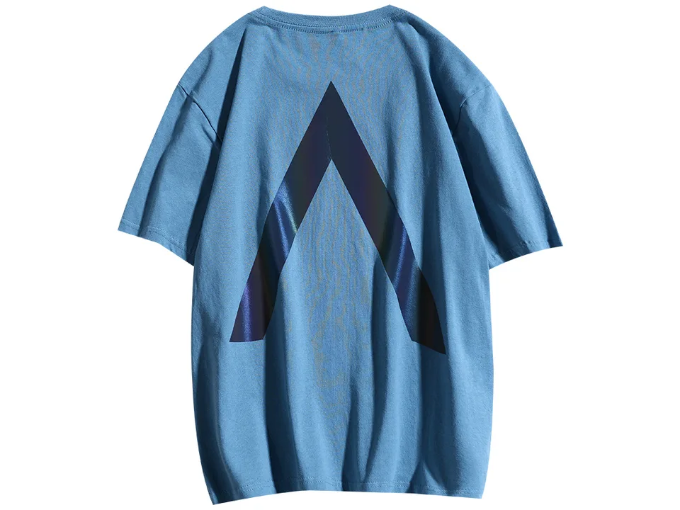 Back view of a blue t-shirt with a large reflective 'A' graphic.