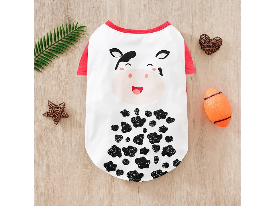 White dog t-shirt with a cartoon cow face print.
