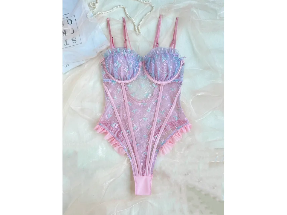 Full view of a pink floral lace bodysuit with ruffled edges.