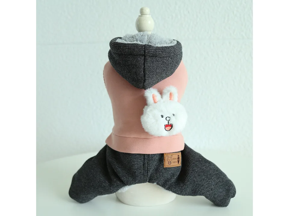 Pink and grey pet jumpsuit with a hood and plush rabbit detail.