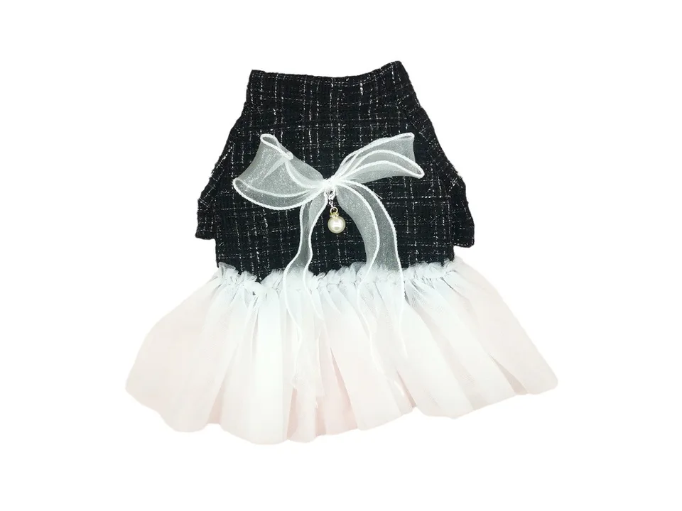 Full view of the black and white plaid dog dress with a white tulle skirt and a pearl-accented bow.