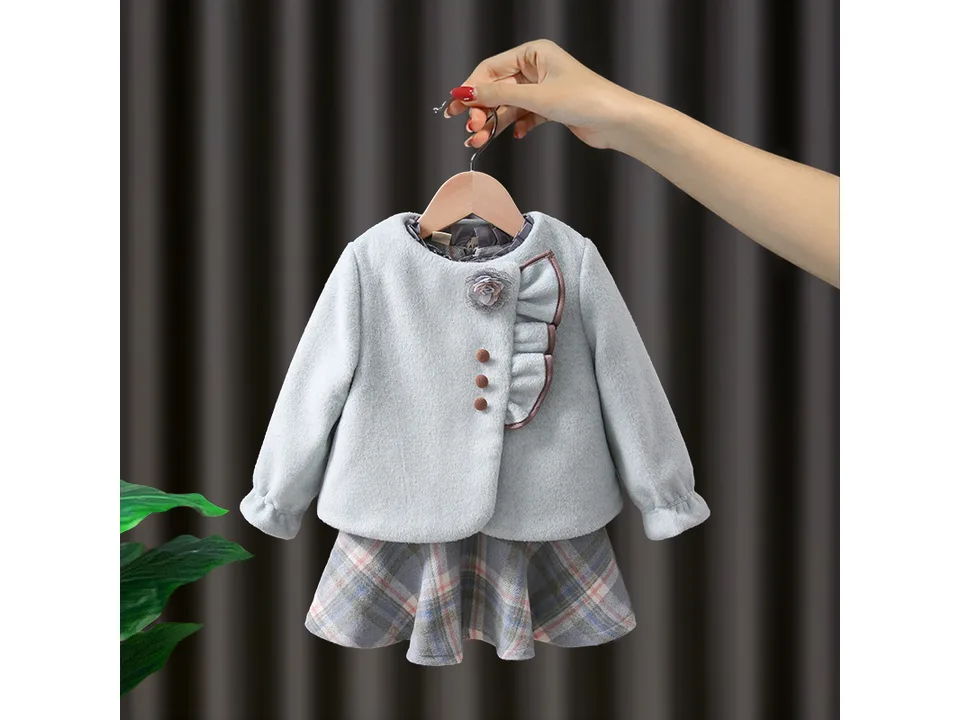 Light blue girls' jacket and dress set on a hanger
