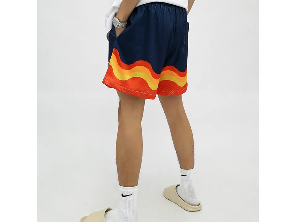 Person wearing the blue version of the athletic shorts from the back.