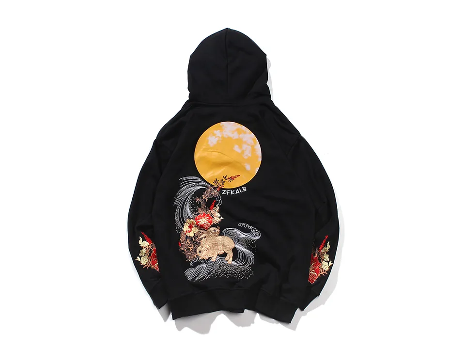Black hoodie with a large moon and rabbit embroidery on the back.