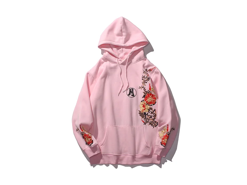 Pink hoodie with floral embroidery on the front and sleeves.