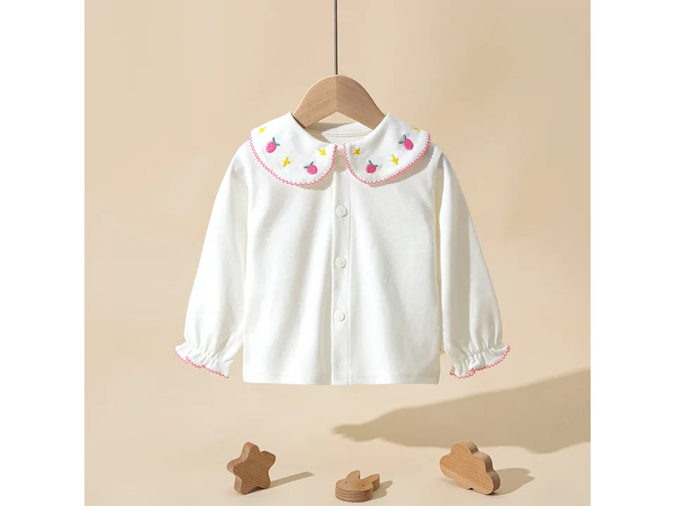 White long-sleeve shirt for girls with a pink embroidered collar featuring fruit designs.