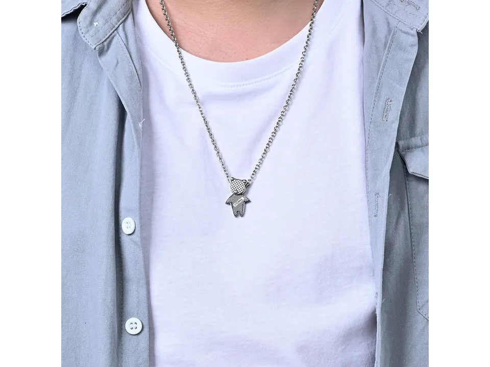 A person wearing the silver bear pendant necklace.