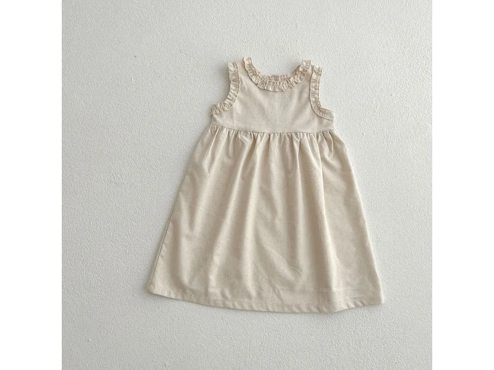 A beige sleeveless baby dress with ruffled neckline.