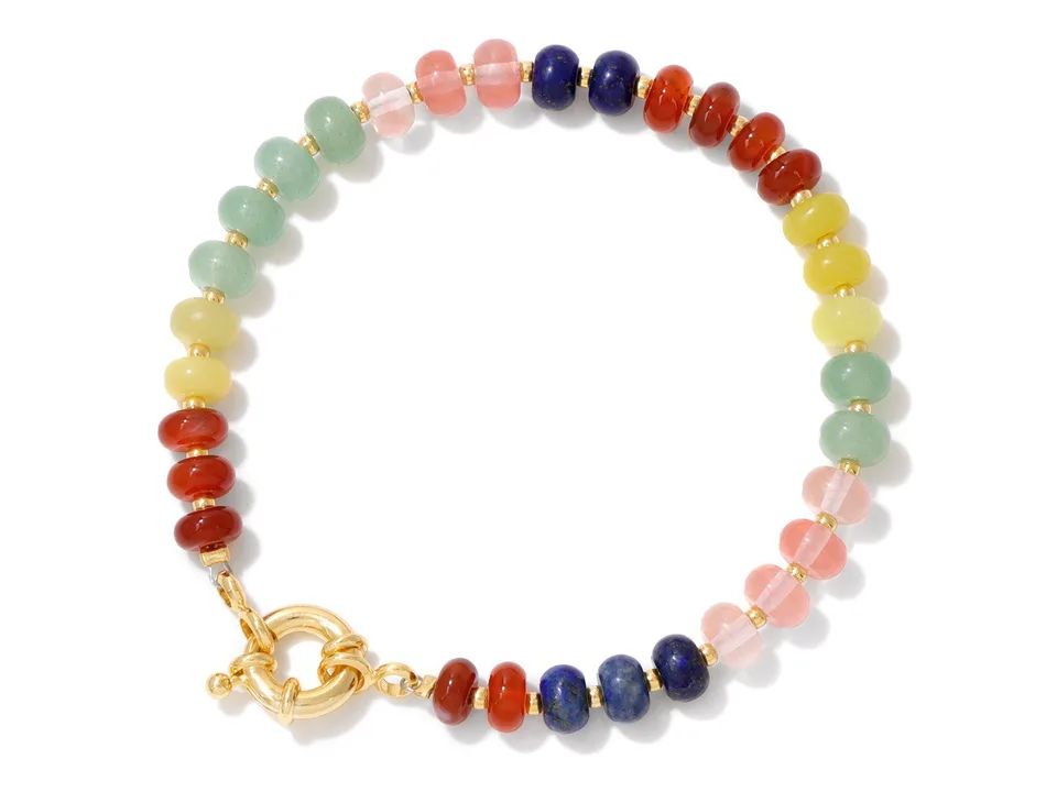 A colorful stone bead bracelet with a gold clasp on a white background.