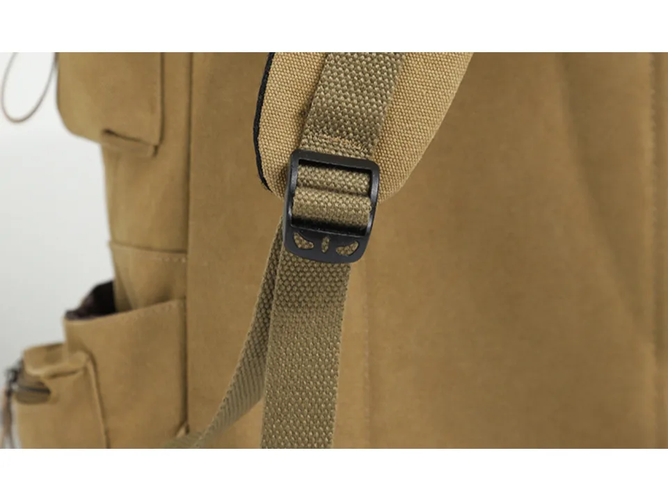 Close-up of the black plastic buckle on the backpack strap.