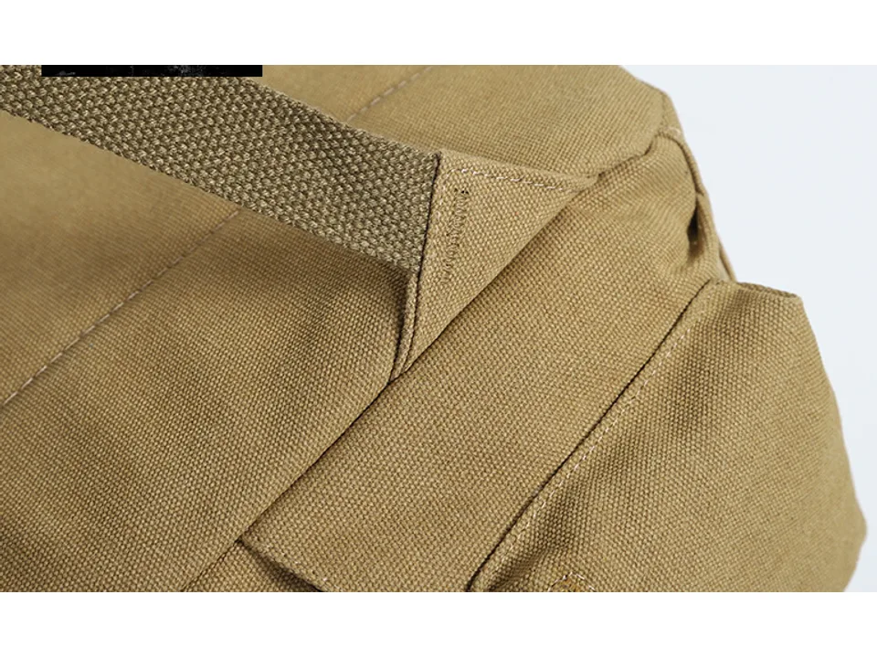 Close-up of the canvas fabric and stitching on the backpack strap attachment.