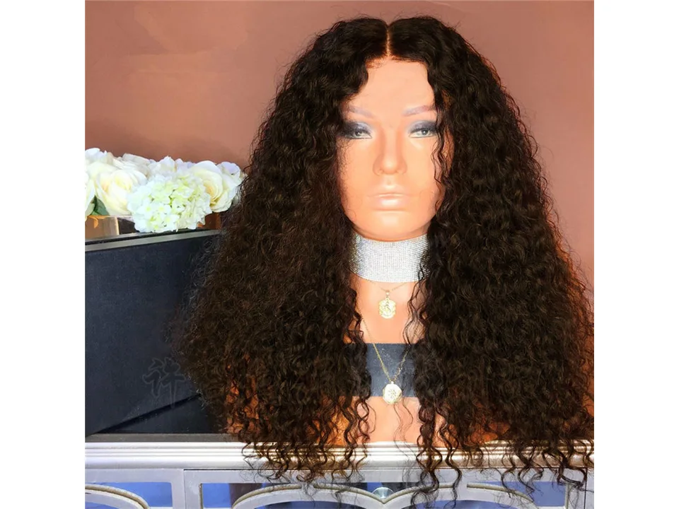 A mannequin head wearing a long, curly black wig, front view.