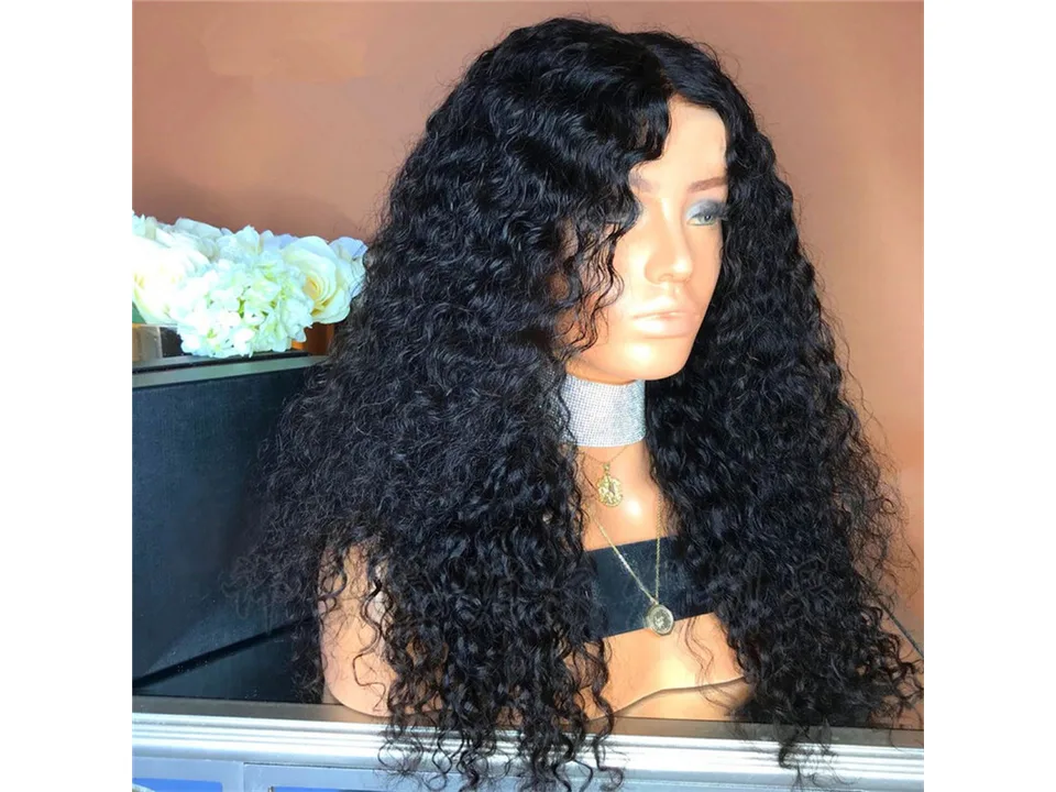A mannequin head wearing a long, curly black wig.