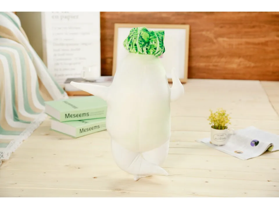 A single white radish plush toy standing on a wooden surface.