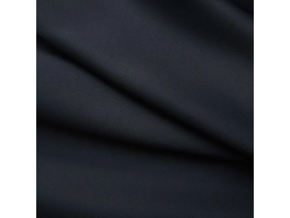 Close-up of the black curtain fabric texture.