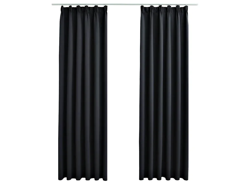 Two black curtains hanging on a rod against a white background.