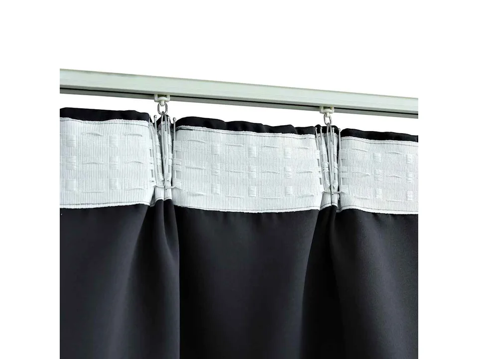 Close-up of the curtain header showing the metal hooks attached to a track.