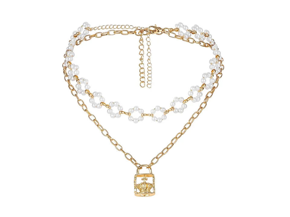 The layered pearl and crown lock necklace on a plain white background.