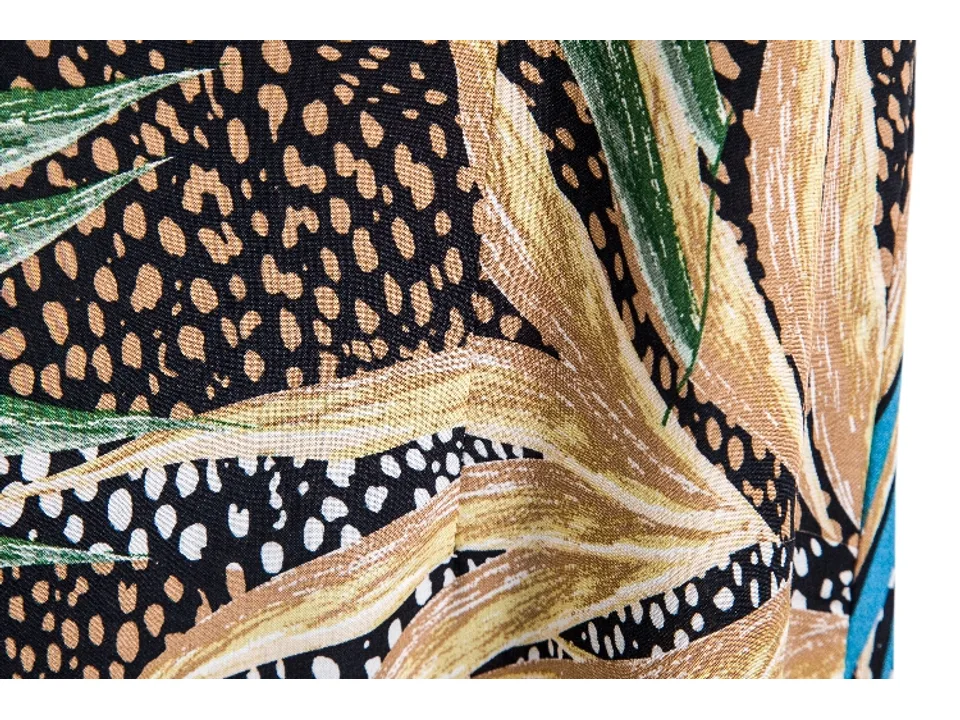 Close-up view of the tropical leaf print fabric.